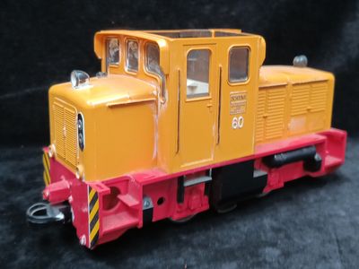 a toy train that is sitting on a black surface