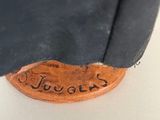 an image of a close up of a piece of metal with writing on it