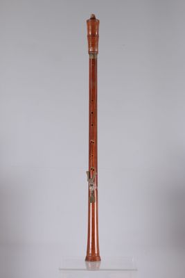 an image of a wooden instrument on a clear surface