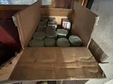 a box full of items sitting on the floor of a garage