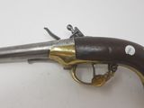 an old gun that is sitting on top of a table