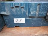 a blue box with a number on it sitting on a wooden table