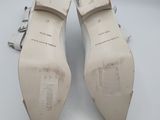 the bottom of a pair of white shoes on a white surface