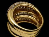 an image of a close up of a gold ring with diamonds