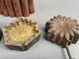 three metal objects that are sitting on a table