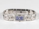 an image of a wrist watch with a blue face on a white surface