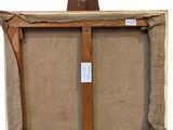 an old wooden easel with a piece of fabric on it
