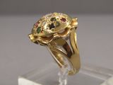 une image représentant une bague en or surmontée d'une tortue