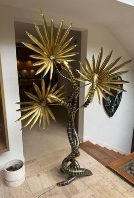 a large metal plant that is sitting on the floor