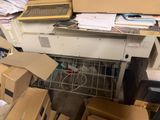 a pile of boxes and a computer on a desk