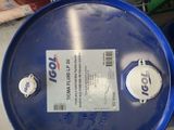 a blue barrel with a tag on it sitting on a table