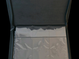 a open suitcase with a lot of papers inside of it