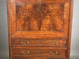 an old wooden dresser with marble top in a room