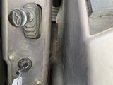 a close up of a car door handle with a key