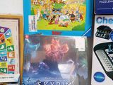 a lot of books and games on the table
