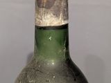 a bottle of wine that is sitting on a table
