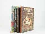 two books sitting on top of each other in front of a white background