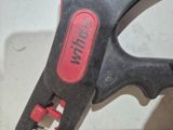 a close up of a pair of pliers on a table