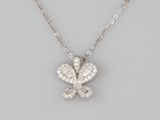 a diamond butterfly pendant on a chain