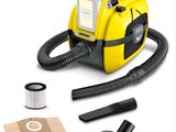 yellow and black vacuum cleaner with cleaning kit and accessories on a white background