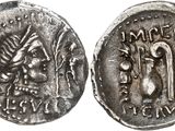 a silver coin with an image of a man and a woman on it