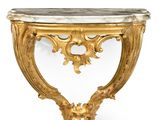 a gold console table with a marble top on a white background