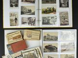 an open book with a bunch of old photos on top of it