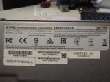 a label on the back of a laptop that says zyxel communications corporation