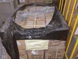 a large pile of boxes sitting on a pallet in a warehouse