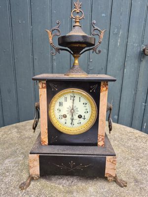 a clock that is sitting on top of a table