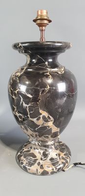a lamp that is sitting on a table next to a lamp