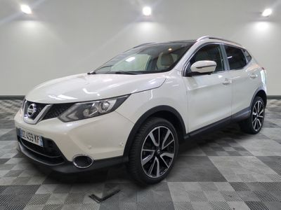 the white nissan suv is parked on a checkered tile floor