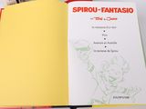 an open book with a picture of a cartoon character on it