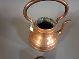 a tea pot and a cup on a table