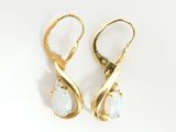 pair of oplite and diamond earrings on a white background