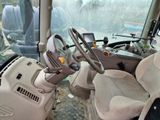a view of the inside of a truck from the driver ' s seat