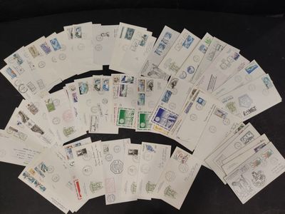 a lot of stamps on a black table top