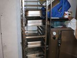 an image of a kitchen with a rack of food in it