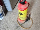 a red and yellow fire extinguisher sitting on the floor