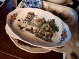 a plate with a picture of a horse drawn carriage on it