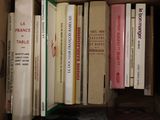 many books that are in a box on the table