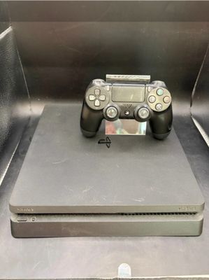 a video game controller sitting on top of a metal box
