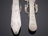 pair of silverware spoons and a knife on a black surface