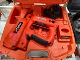 an orange tool box with tools in it on a table