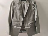 an image of a suit hanging on a hanger