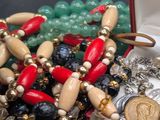 a box full of beads and a pair of scissors in it