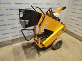 a small yellow machine sitting on top of a cement floor
