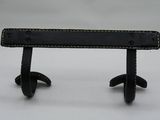 a black bench that has a leather seat on it
