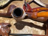 a lot of pipe holders that are on a table