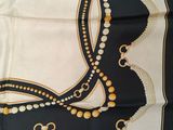 an image of a square scarf with beads and tassels